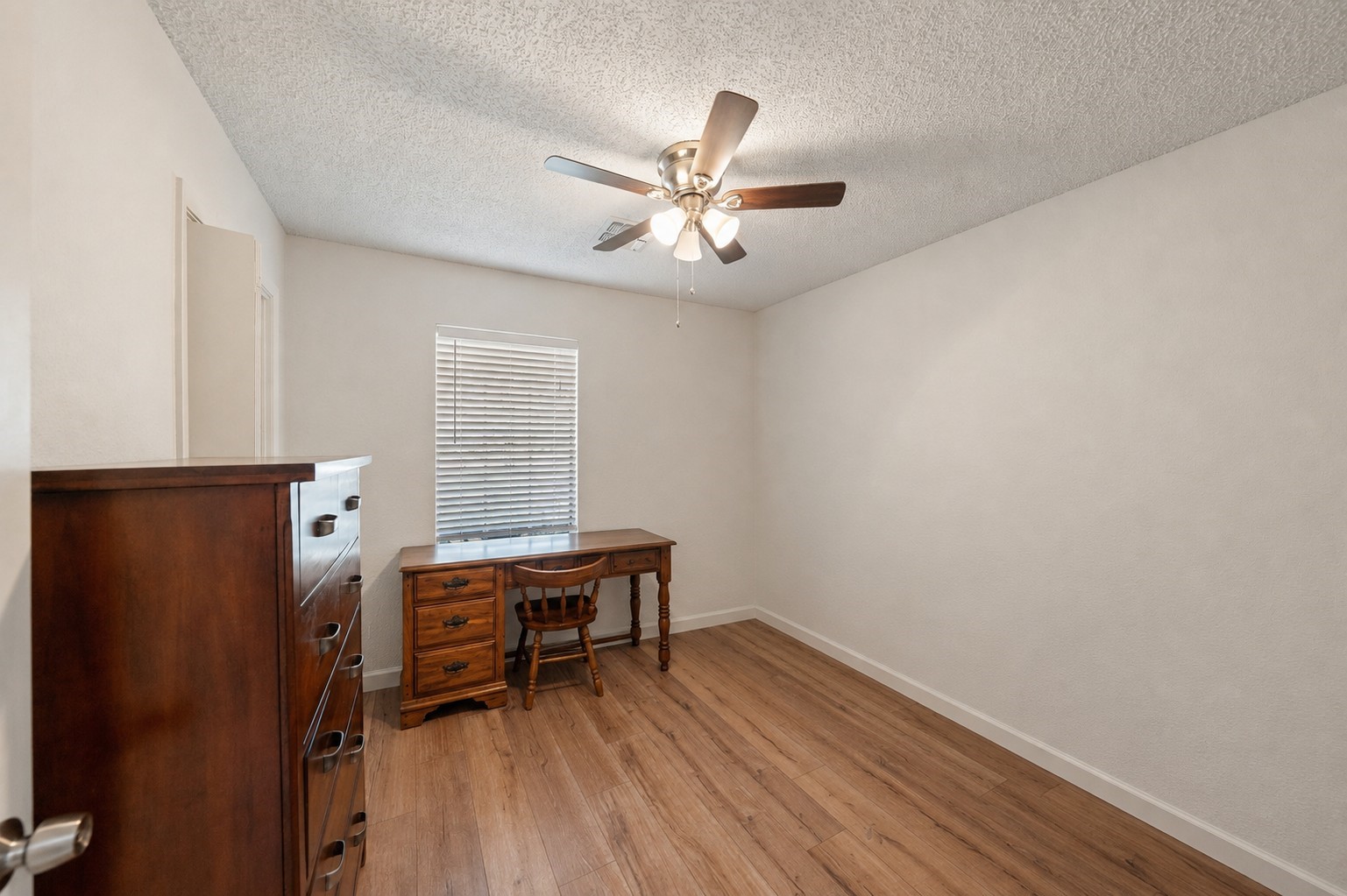 25739 Old Howth Road Hempstead, TX 77445 - Photo 22 of 36 This spacious guest bedroom is ready to host with updated wood-look laminate flooring, soft neutral finishes, a large closet and easy access to a full bathroom.