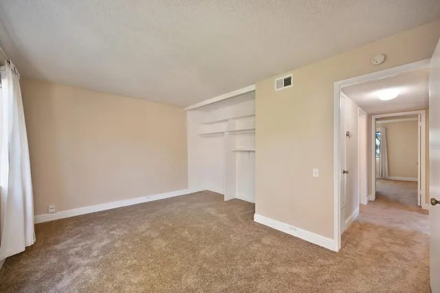a backyard of a house with yard and outdoor seating