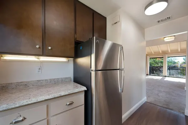 a close view of a sink and a microwave in a kitchen