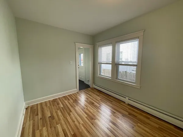a bedroom with furniture and a piano