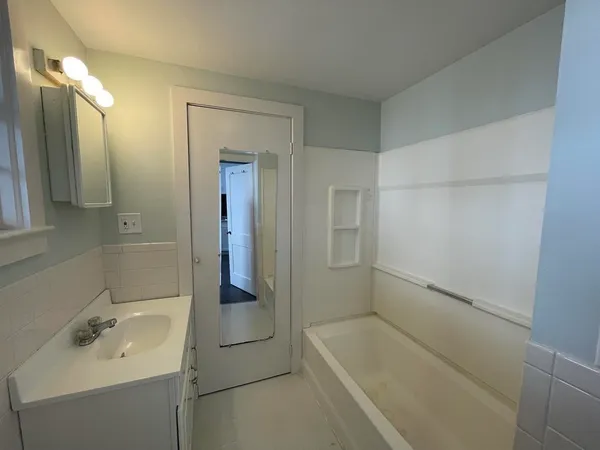 a bathroom with a sink and toilet