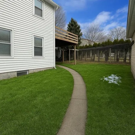 a roof deck with couch and chairs