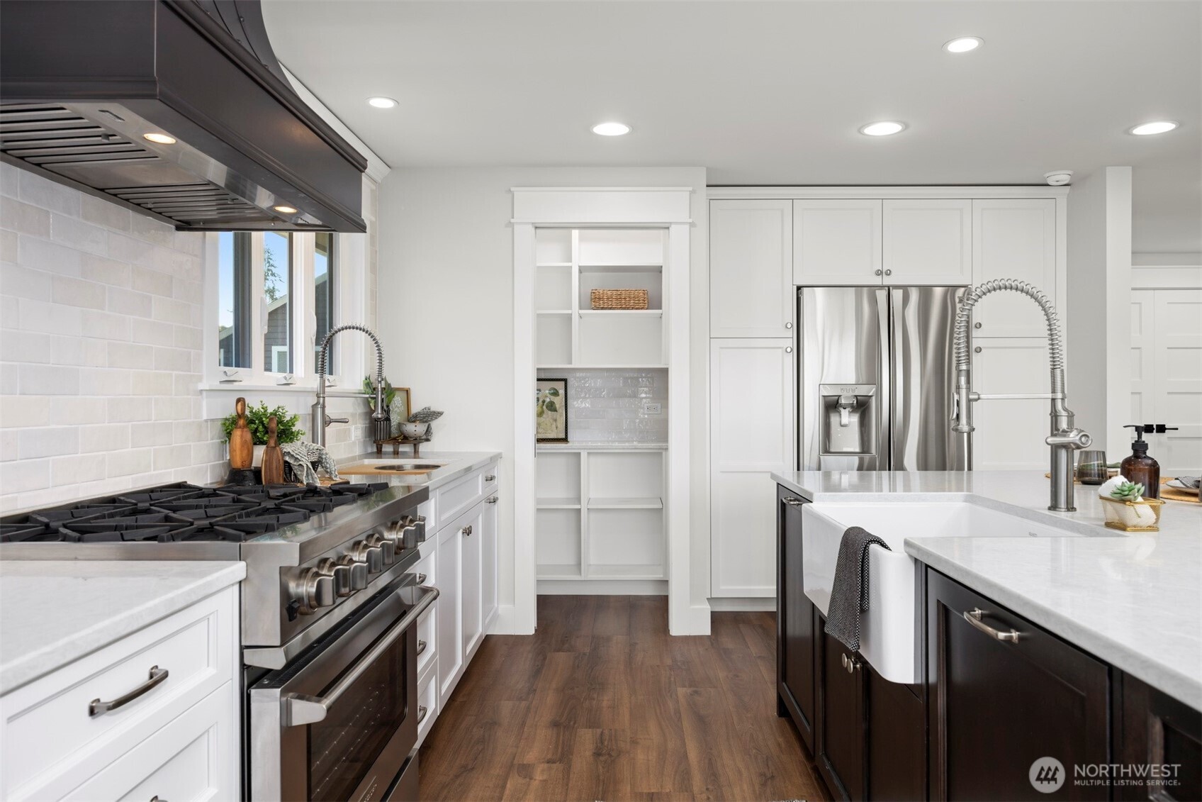 3505 East Smith Road Bellingham, WA 98226 - Photo 11 of 40 a kitchen with stainless steel appliances granite countertop a sink stove and refrigerator