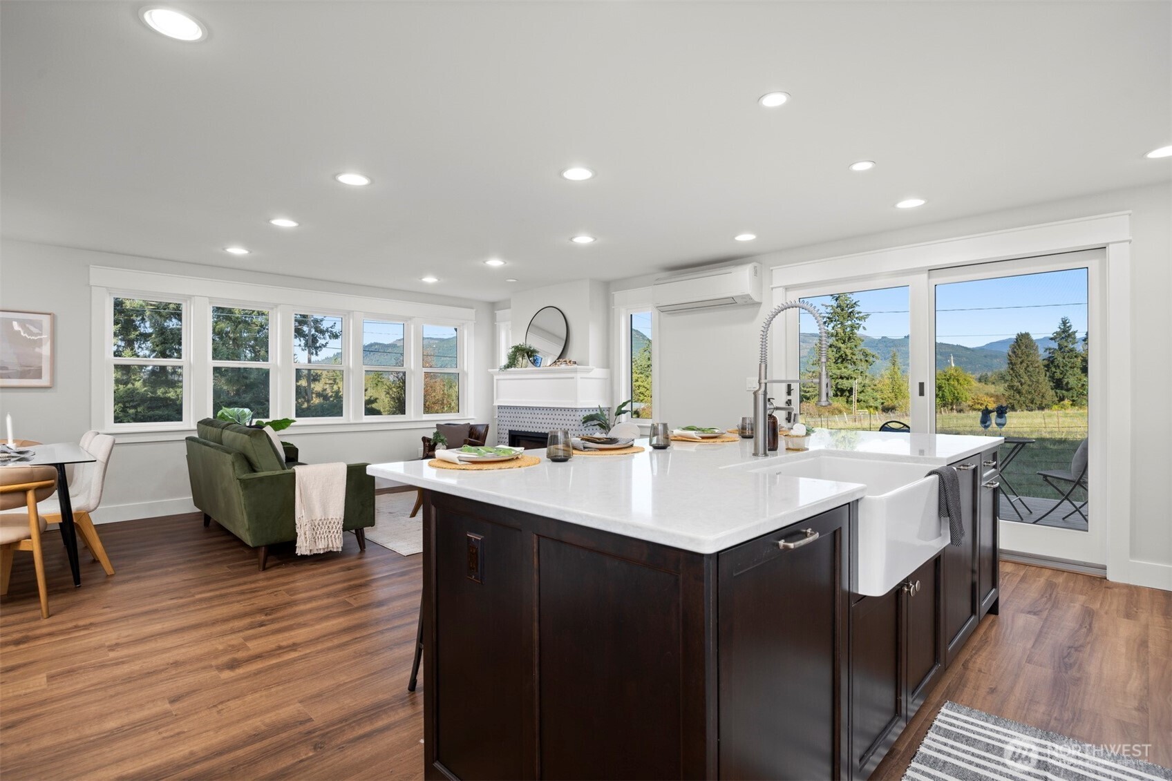 3505 East Smith Road Bellingham, WA 98226 - Photo 13 of 40 a kitchen with counter top space sink stove and wooden floor