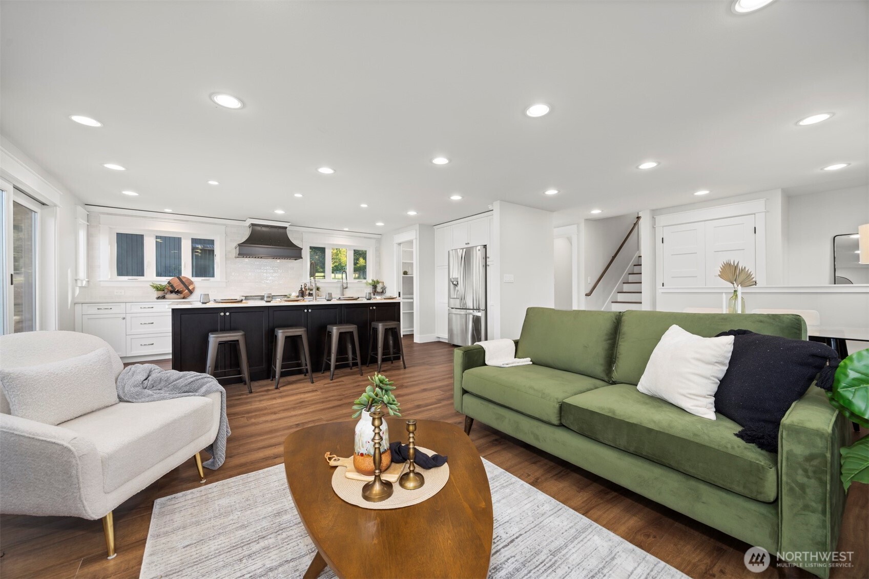 3505 East Smith Road Bellingham, WA 98226 - Photo 16 of 40 a living room with furniture kitchen view and a table