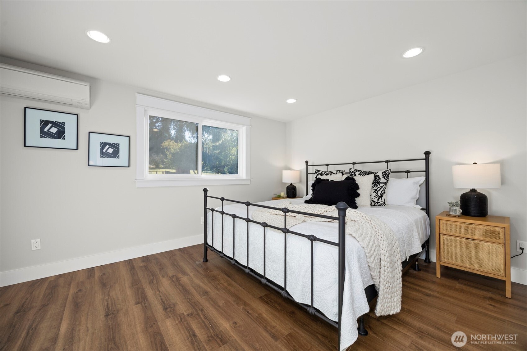 3505 East Smith Road Bellingham, WA 98226 - Photo 19 of 40 a bedroom with a bed and wooden floor