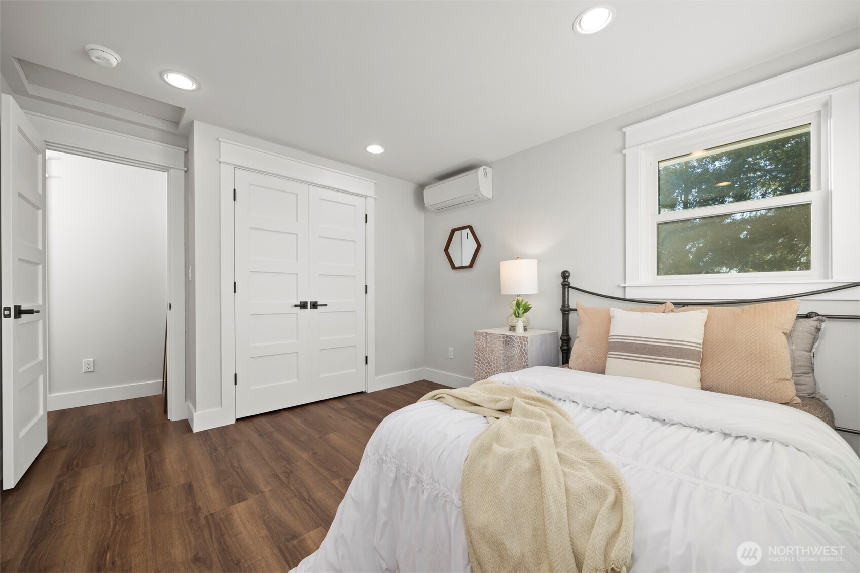 3505 East Smith Road Bellingham, WA 98226 - Photo 23 of 40 a bedroom with a large bed and wooden floor