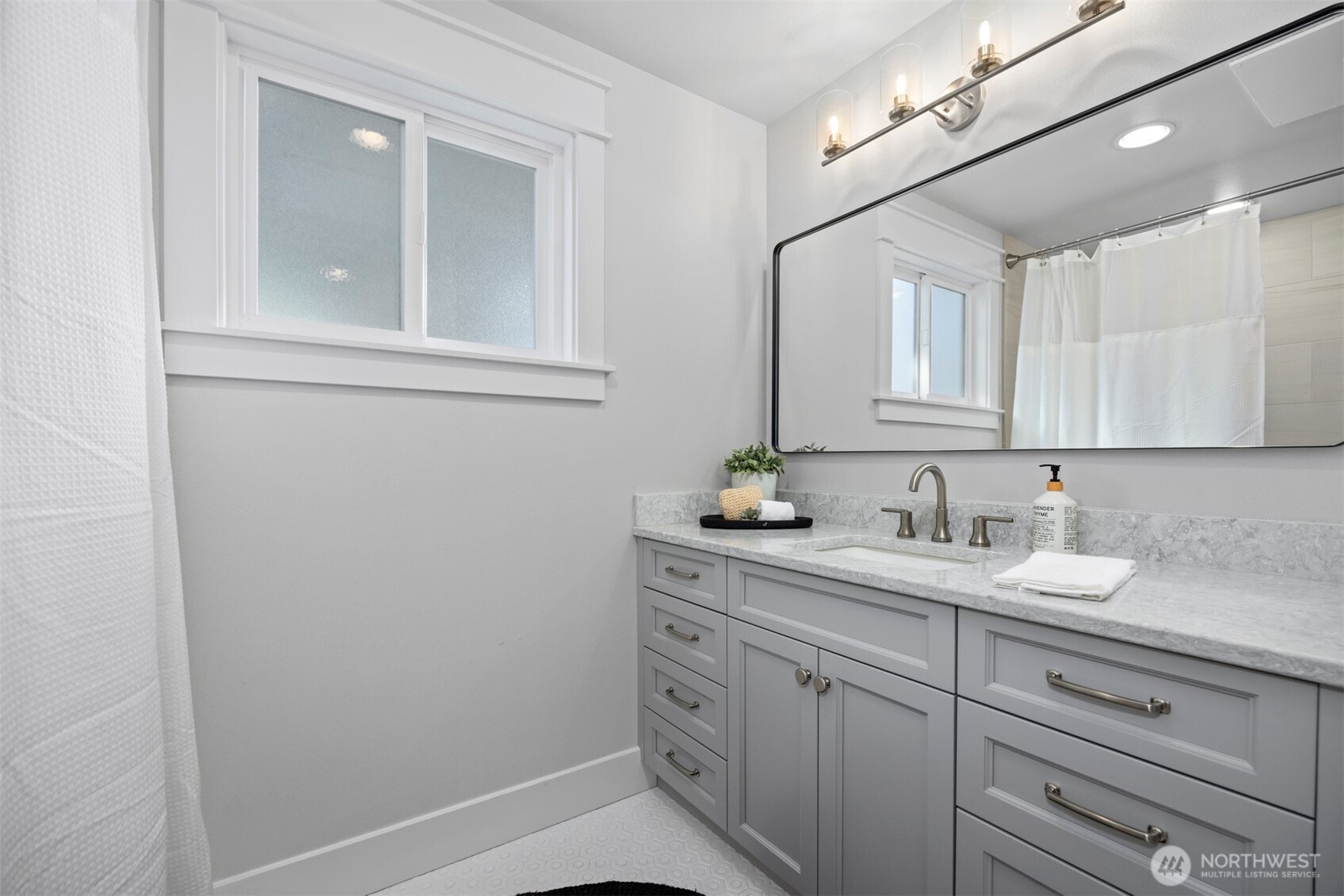 3505 East Smith Road Bellingham, WA 98226 - Photo 24 of 40 a bathroom with a granite countertop sink and a mirror