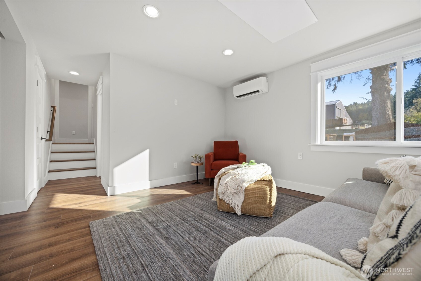 3505 East Smith Road Bellingham, WA 98226 - Photo 26 of 40 a bedroom with bed and wooden floor