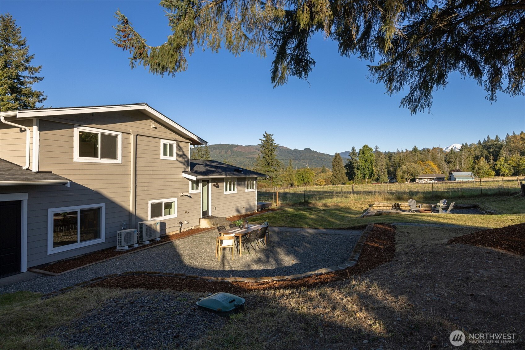 3505 East Smith Road Bellingham, WA 98226 - Photo 32 of 40 a view of a house with backyard and sitting area