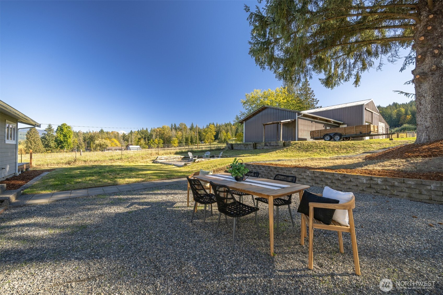 3505 East Smith Road Bellingham, WA 98226 - Photo 33 of 40 a view of a patio with a table and chairs under an umbrella
