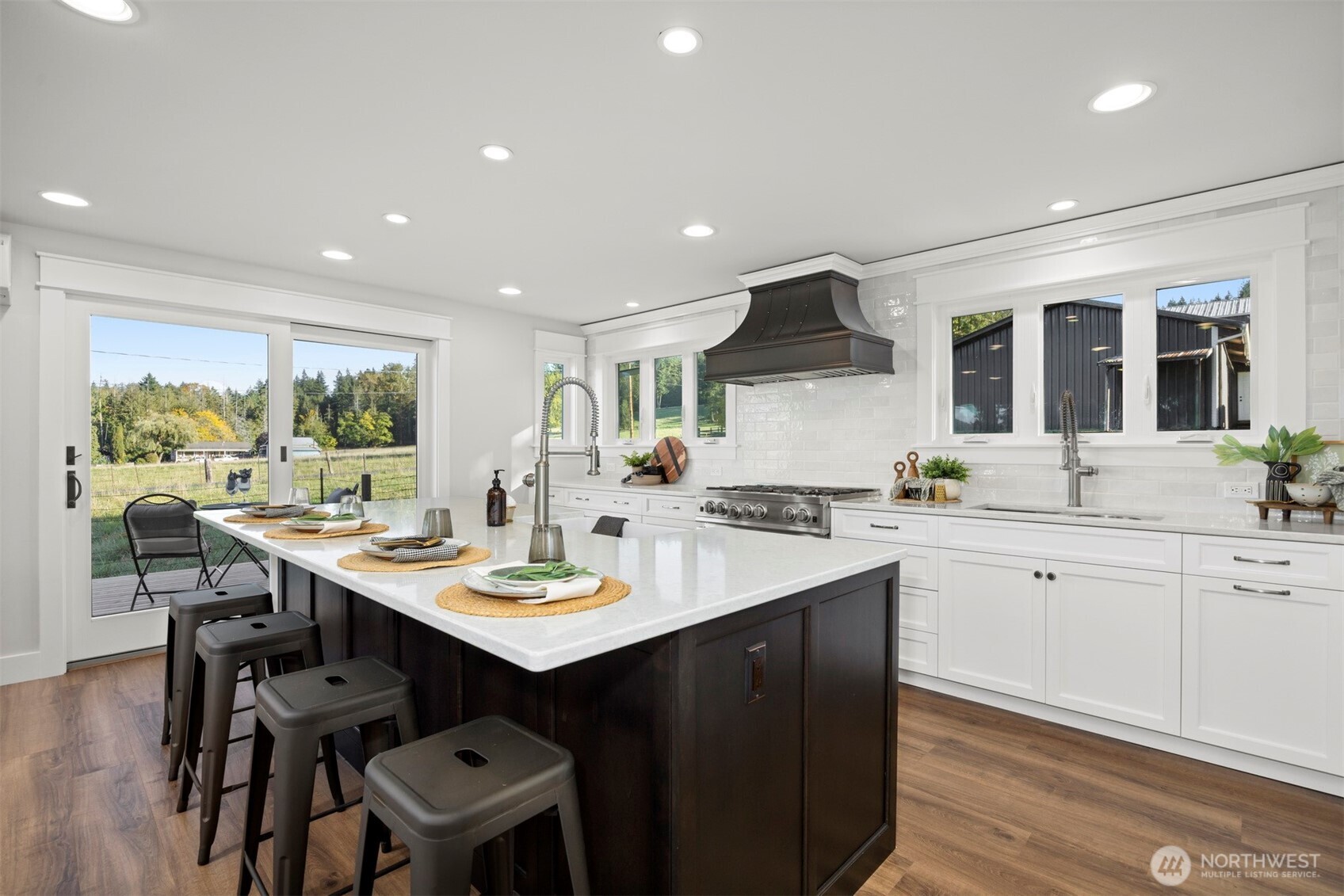 3505 East Smith Road Bellingham, WA 98226 - Photo 10 of 40 a kitchen with a sink cabinets and wooden floor