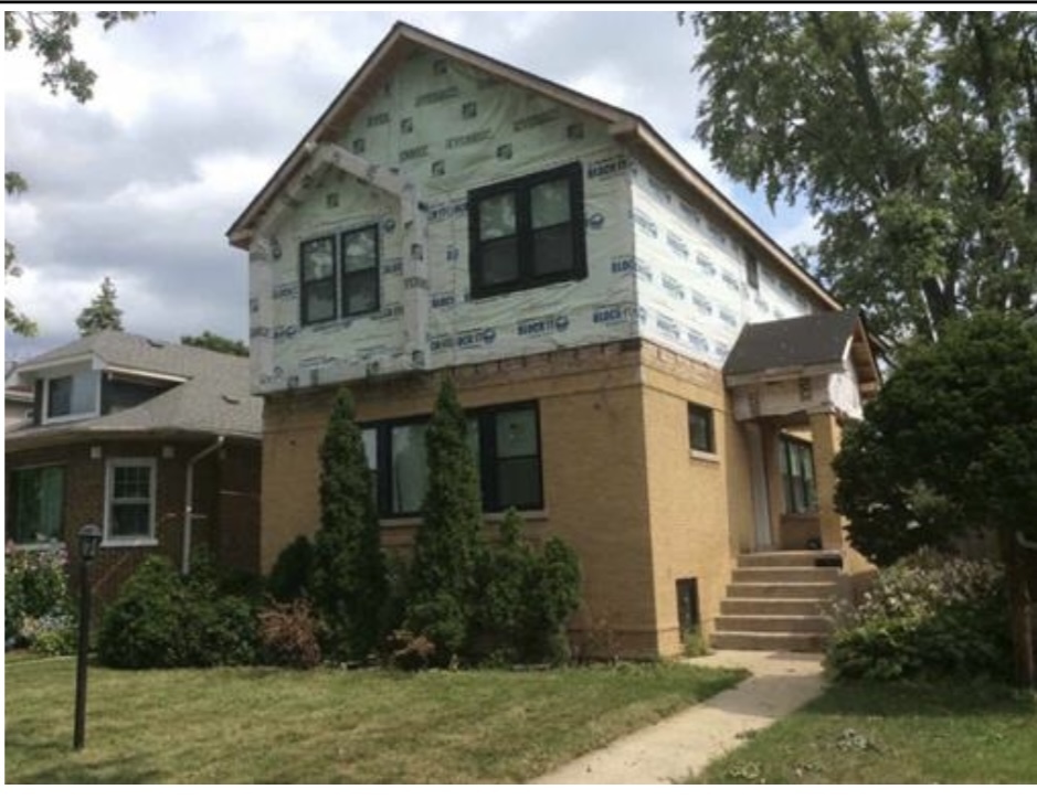 2035 South 11th Avenue Maywood, IL 60153 - Photo 1 of 14 a front view of a house with garden