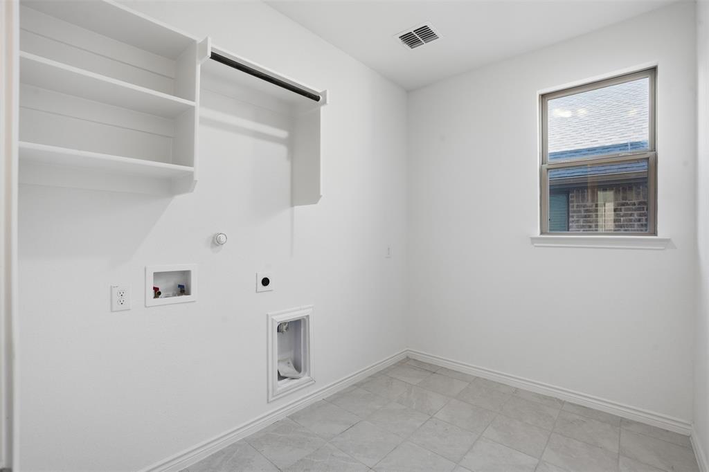 537 Oakmoss Street Little Elm, TX 76227 - Photo 23 of 39 a view of an empty room