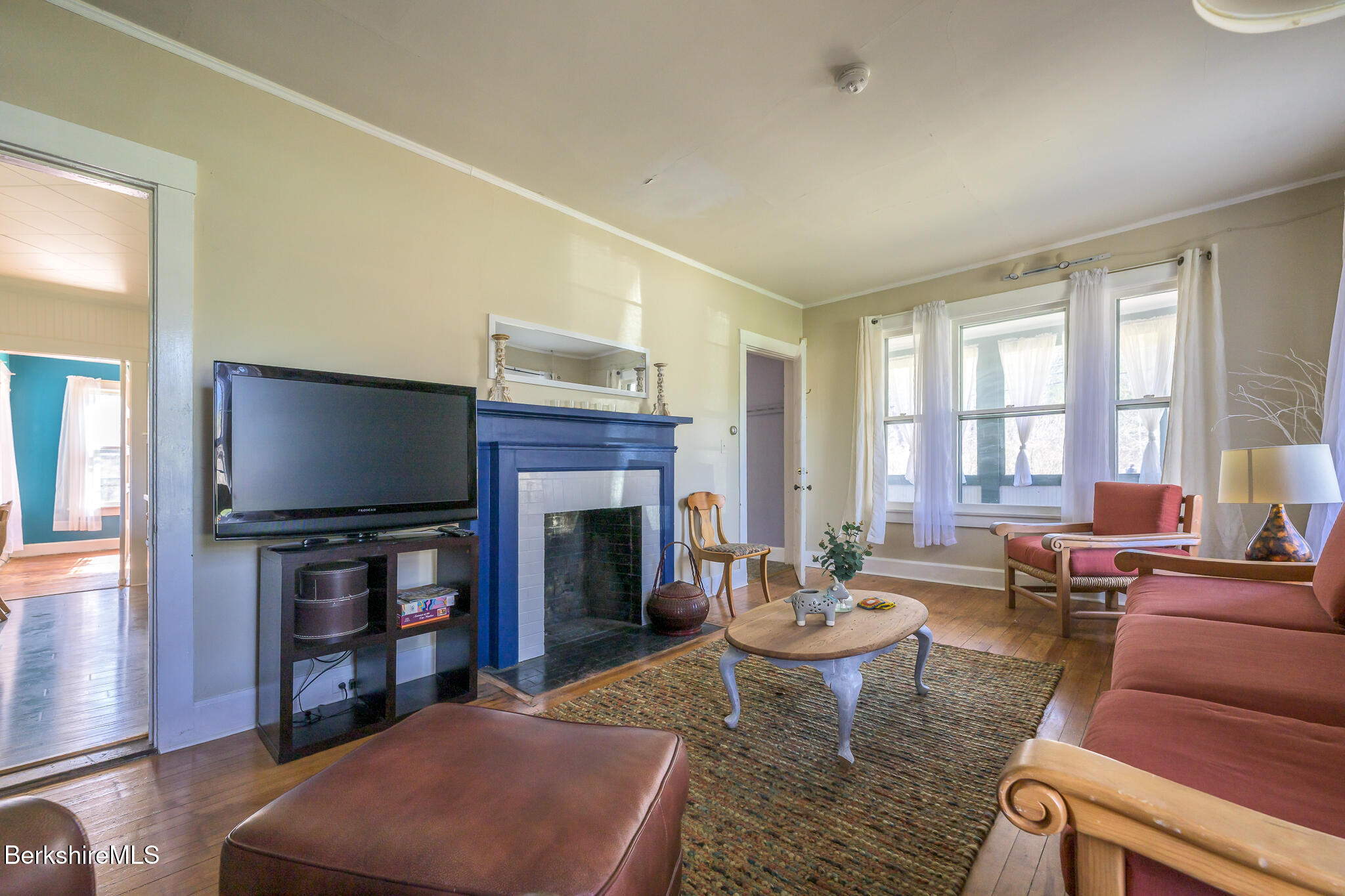 6 East Street Stockbridge, MA 01262 - Photo 8 of 23 a living room with furniture a fireplace and a flat screen tv