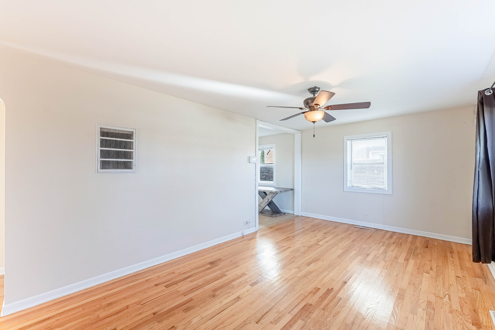 16154 Honore Avenue Markham, IL 60428 - Photo 11 of 32 wooden floor in an empty room with a window