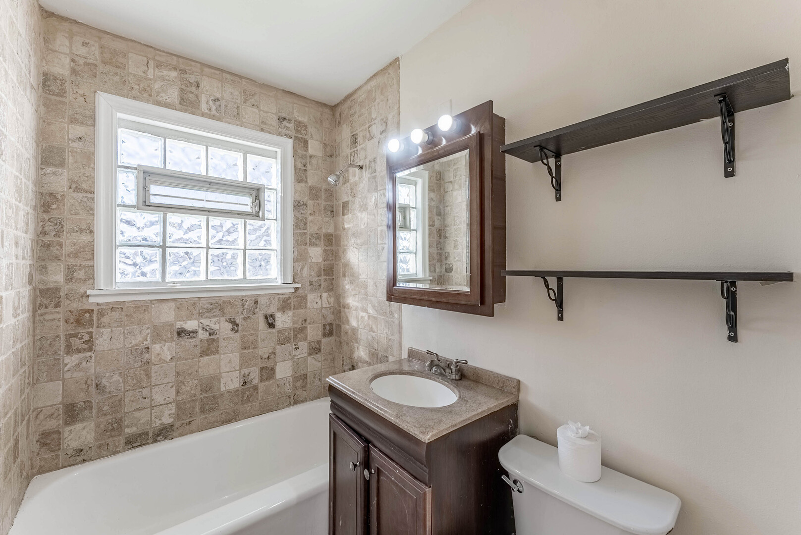 16154 Honore Avenue Markham, IL 60428 - Photo 17 of 32 a bathroom with a sink toilet vanity and bathtub