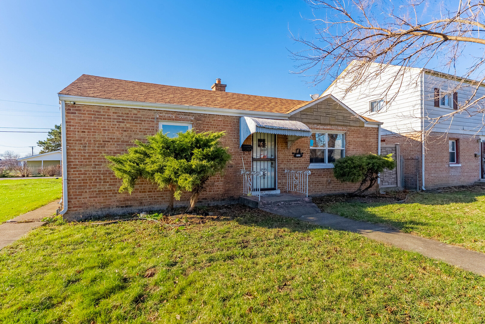 16154 Honore Avenue Markham, IL 60428 - Photo 2 of 32 a view of a house with a yard