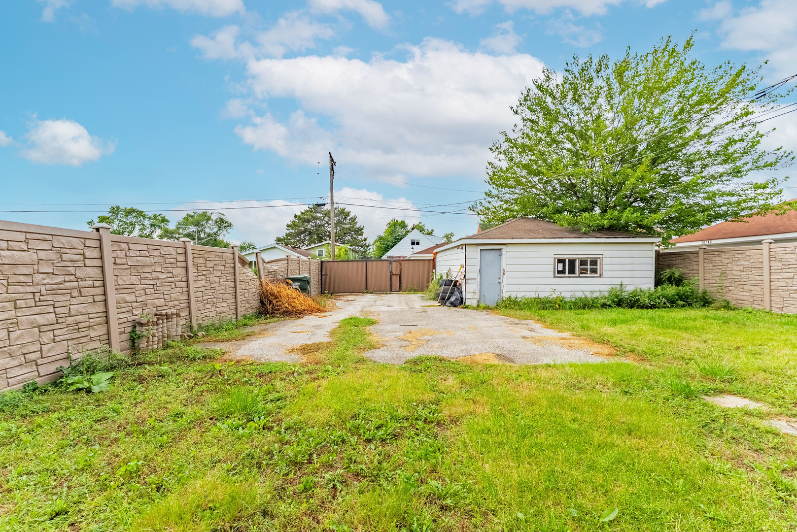 16154 Honore Avenue Markham, IL 60428 - Photo 30 of 32 a front view of a house with a garden and yard