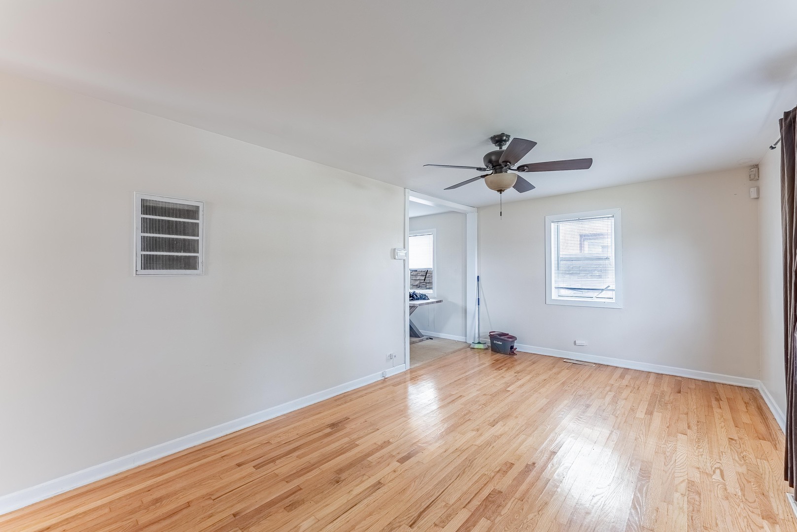 16154 Honore Avenue Markham, IL 60428 - Photo 8 of 32 a view of empty room with wooden floor and ceiling fan