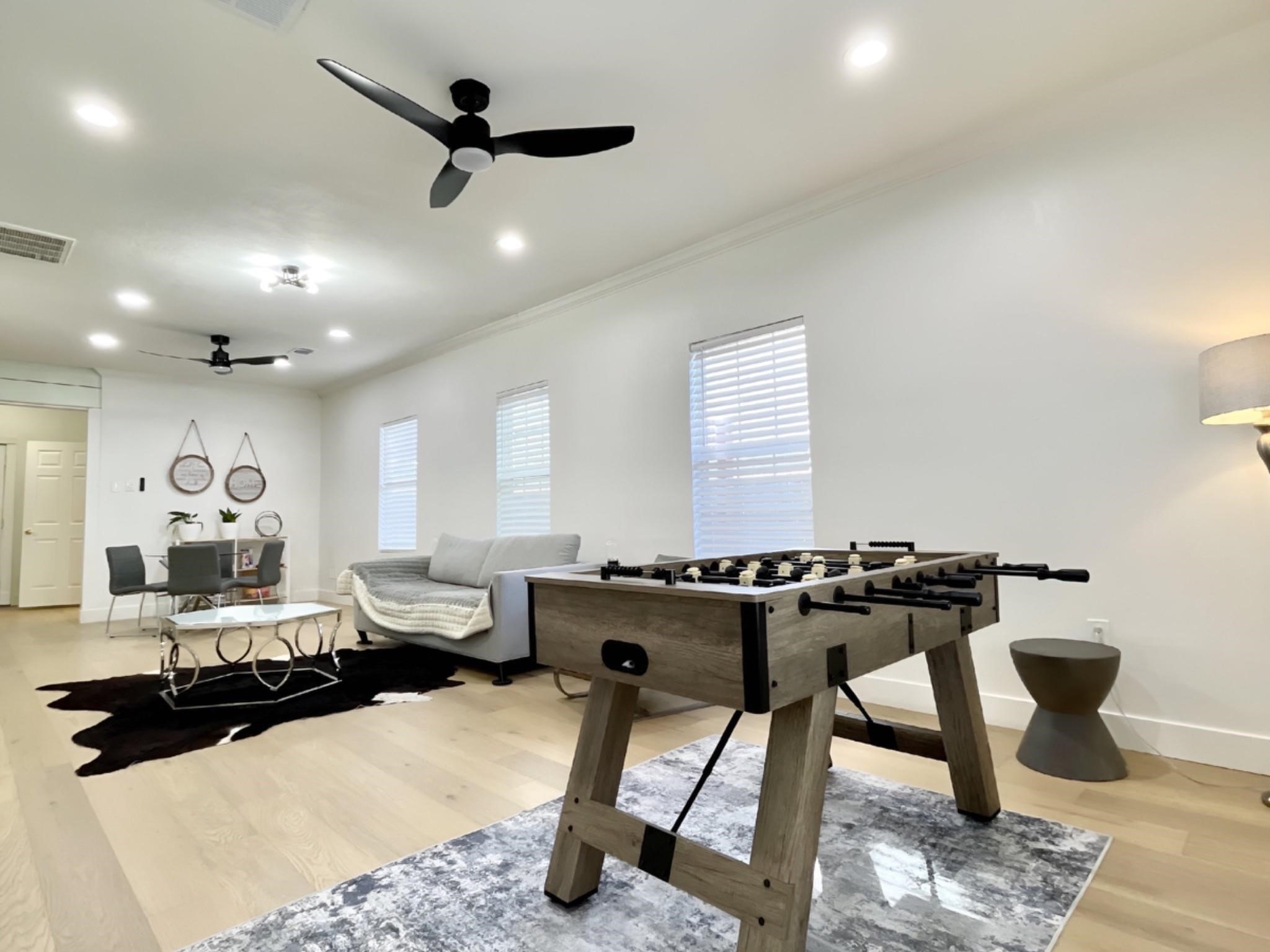 301 Tabor Street Houston, TX 77009 - Photo 1 of 14 a living room with furniture a window and a chandelier