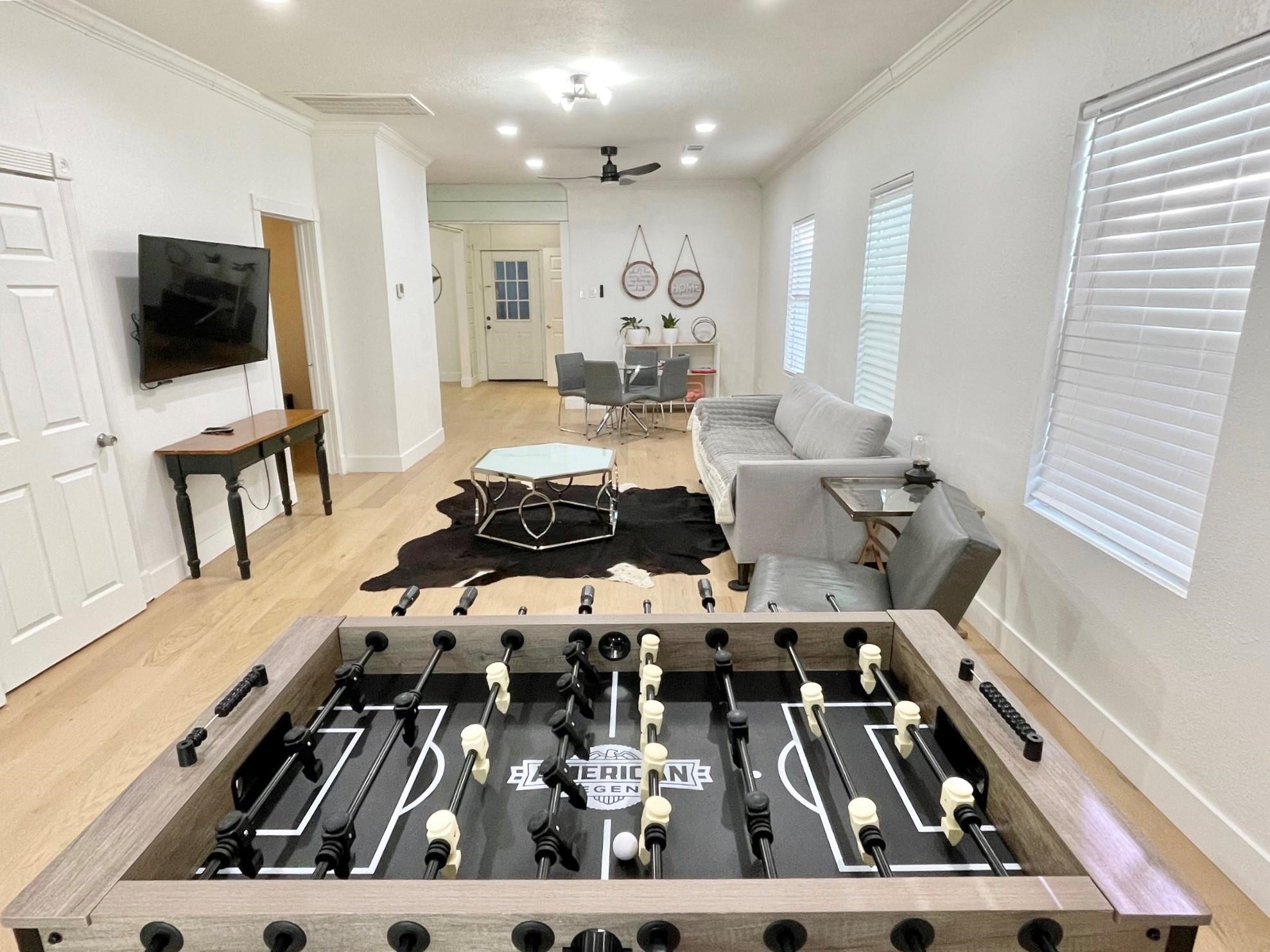 301 Tabor Street Houston, TX 77009 - Photo 14 of 14 a living room with furniture and a flat screen tv