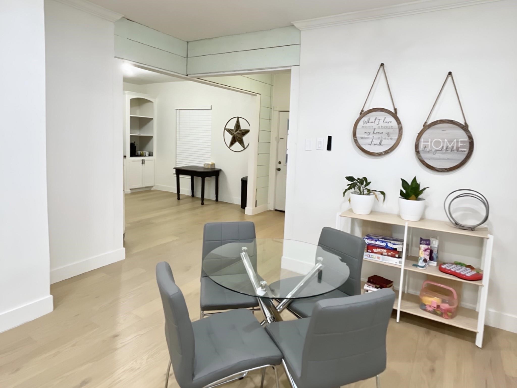 301 Tabor Street Houston, TX 77009 - Photo 4 of 14 a living room with furniture and a clock