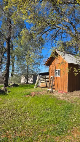 a view of swimming pool with a yard
