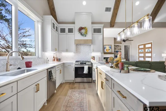 a kitchen with cabinets and window