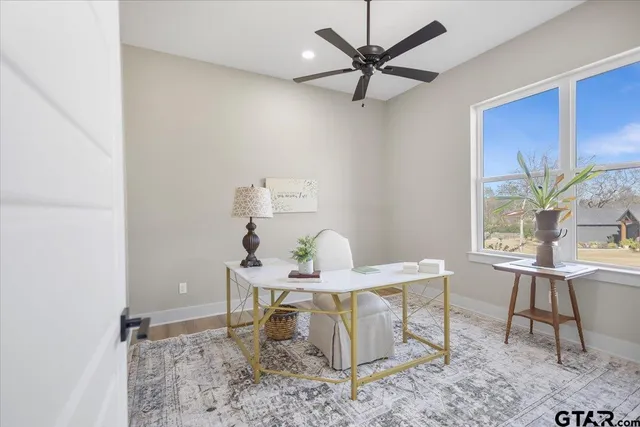 a dining room with a table and chairs
