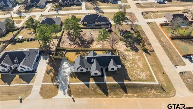 a view of a backyard of the house with outdoor seating