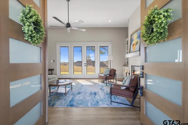 a living room with furniture and a potted plant
