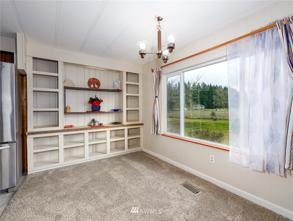 484 West Avery Road Winlock, WA 98596 - Photo 8 of 39 a view of a bedroom with cabinet and windows