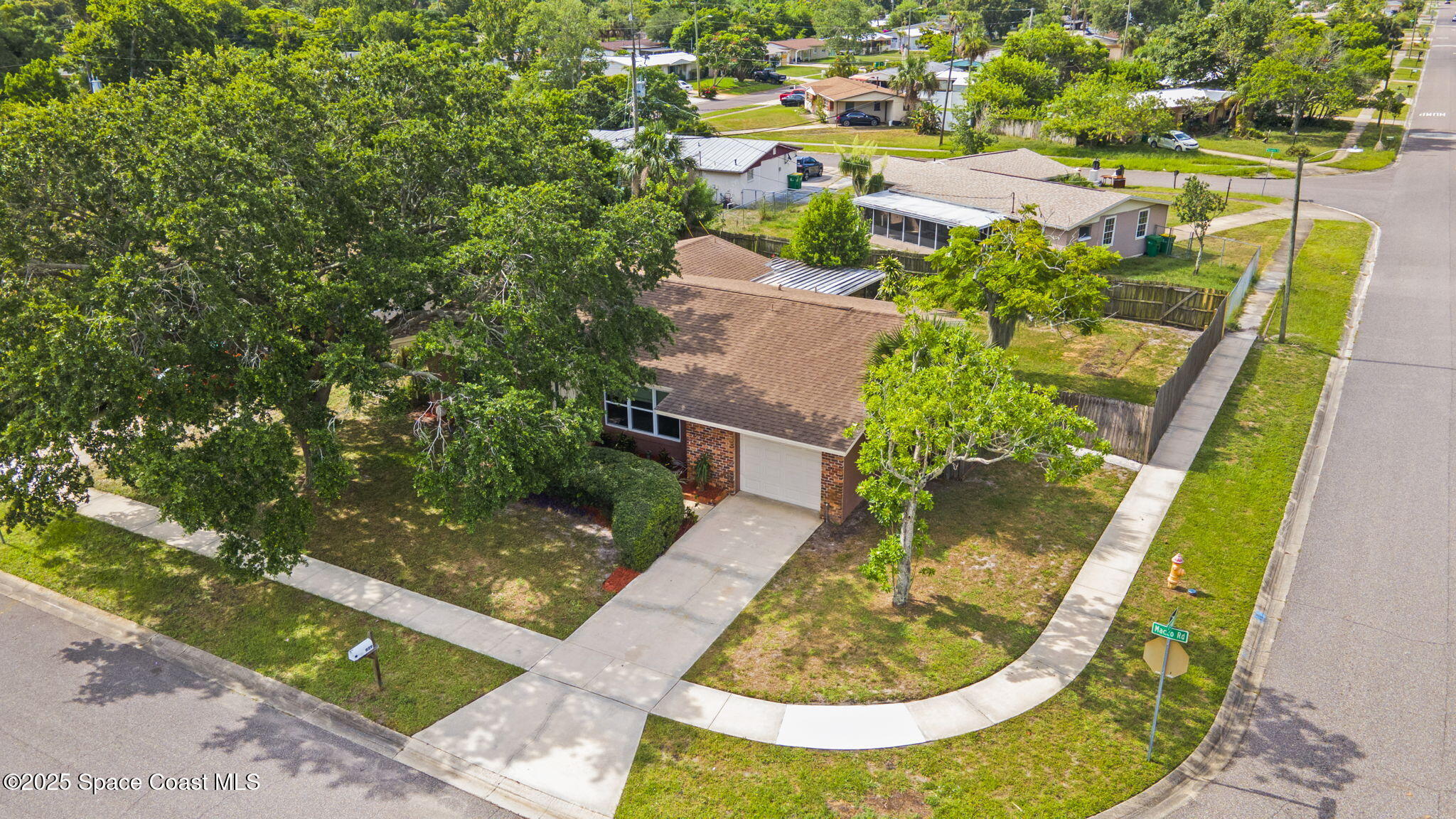 959 Macco Road Cocoa, FL 32927 - Photo 32 of 34 an aerial view of a house with swimming pool and outdoor seating