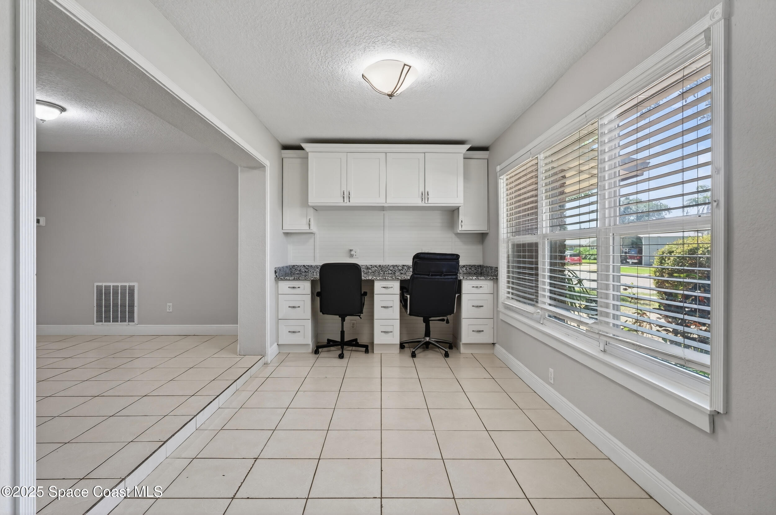 959 Macco Road Cocoa, FL 32927 - Photo 4 of 34 a view of a kitchen with microwave and cabinets