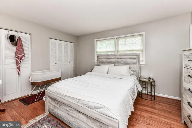 a bedroom with a bed and a table