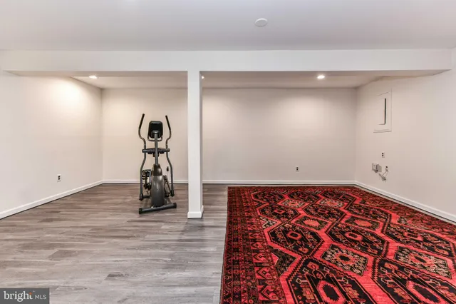 a view of a room with wooden floor