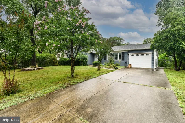 a view of house with yard and entertaining space