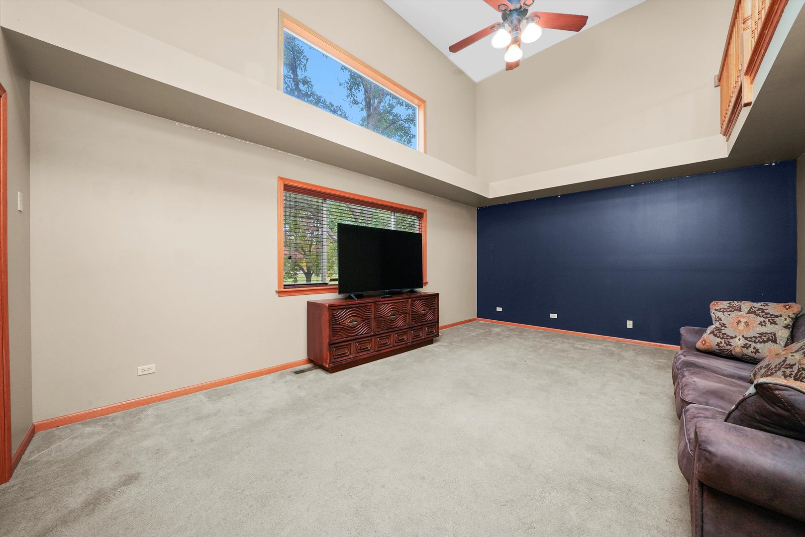 497 Pheasant Chase Drive Bolingbrook, IL 60490 - Photo 11 of 33 a living room with furniture and a flat screen tv