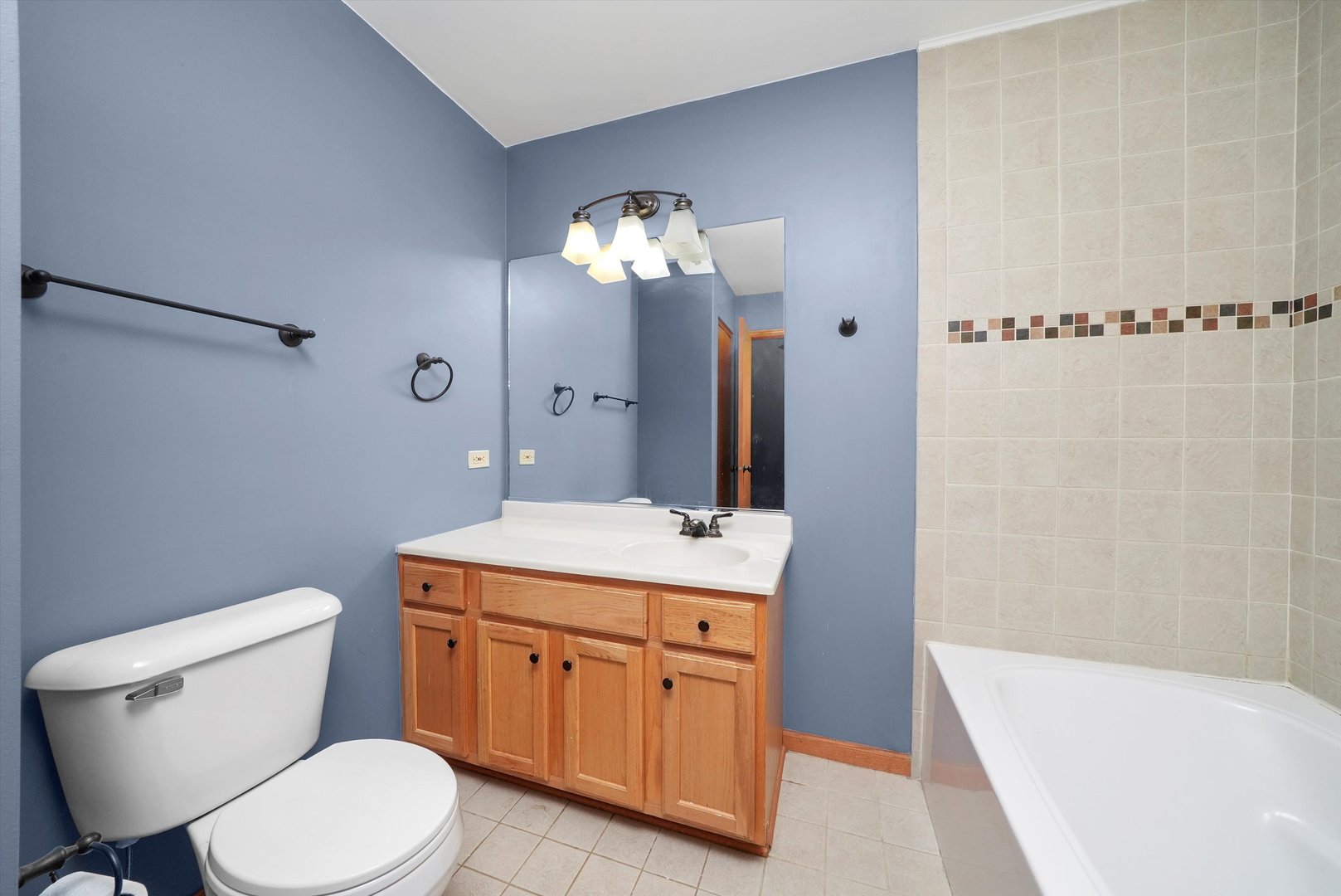 497 Pheasant Chase Drive Bolingbrook, IL 60490 - Photo 14 of 33 a bathroom with a toilet sink and mirror