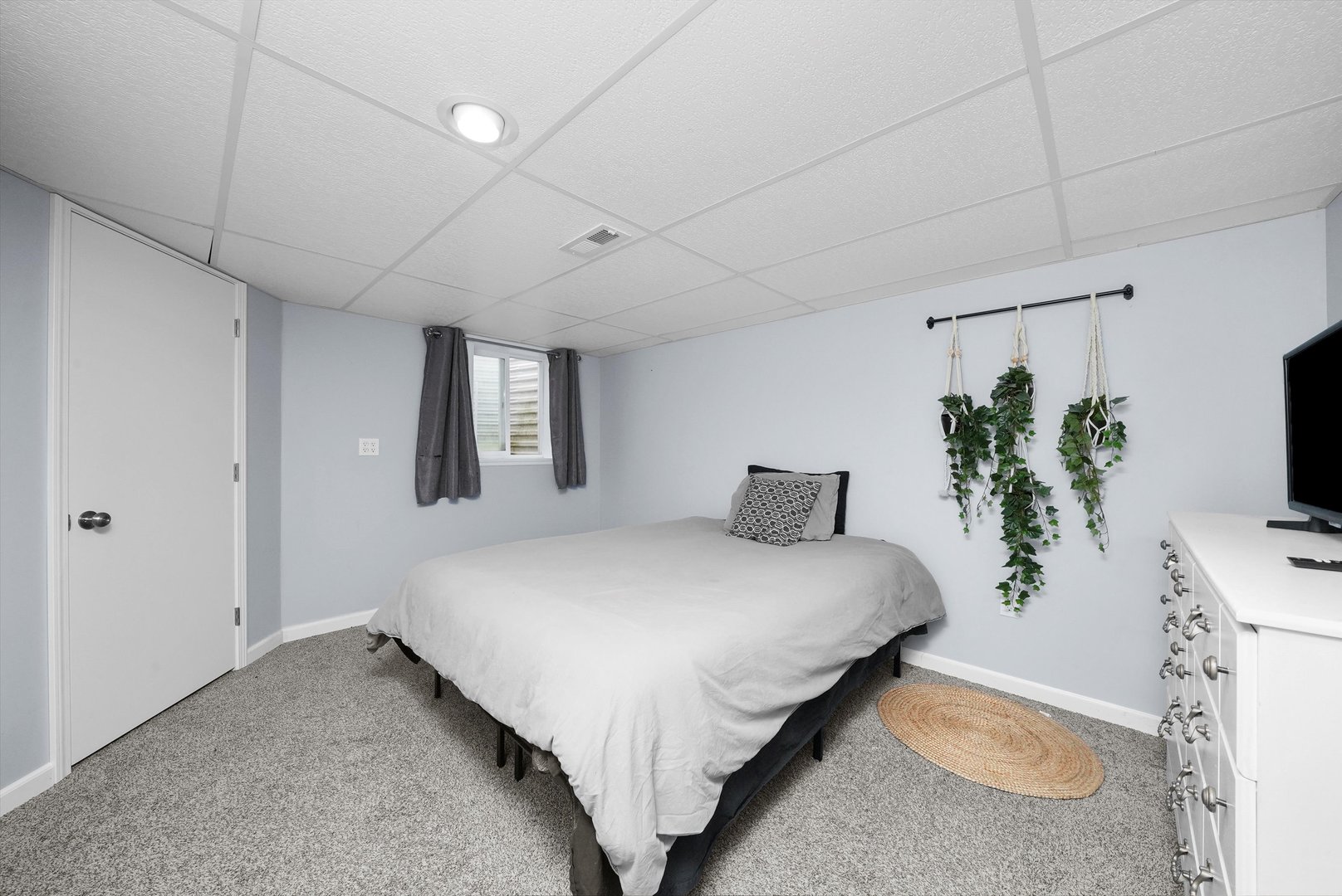 497 Pheasant Chase Drive Bolingbrook, IL 60490 - Photo 22 of 33 a large bed sitting in a spacious bedroom next to a window and a flat screen tv