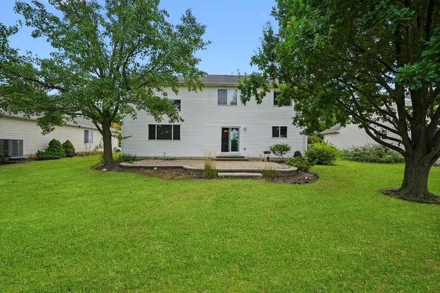 a view of a house with backyard