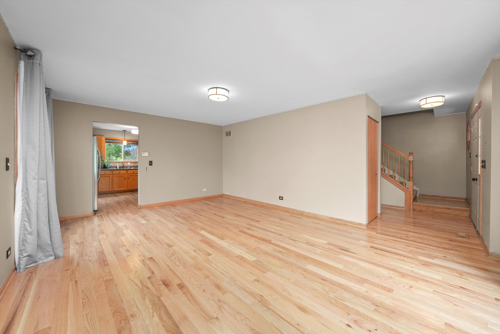 497 Pheasant Chase Drive Bolingbrook, IL 60490 - Photo 4 of 33 a view of empty room with wooden floor