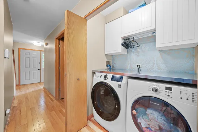 a view of a hallway with washer and dryer
