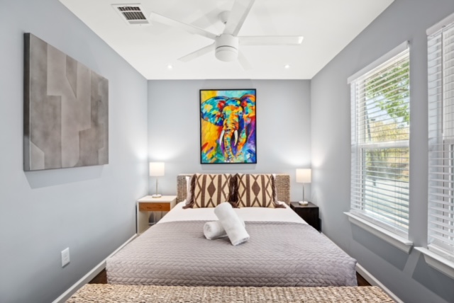1183 Coleto Street Austin, TX 78702 - Photo 15 of 17 a white bed sitting in a bedroom next to a window