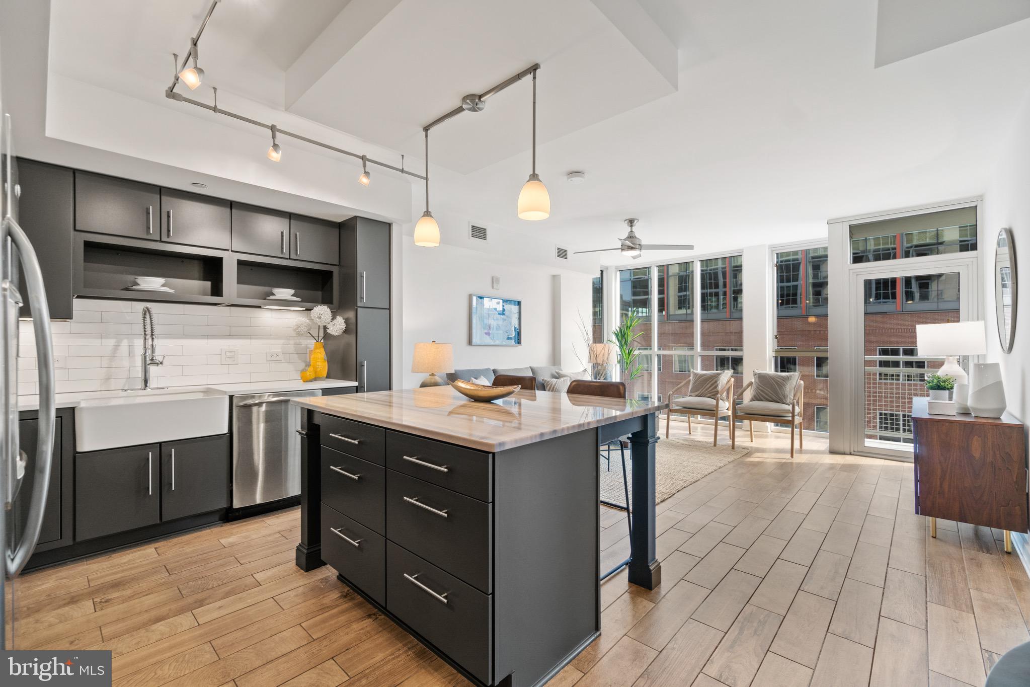 1025 First Street Southeast, Unit 1010 Washington, DC 20003 - Photo 2 of 36 a kitchen with a stove and cabinets