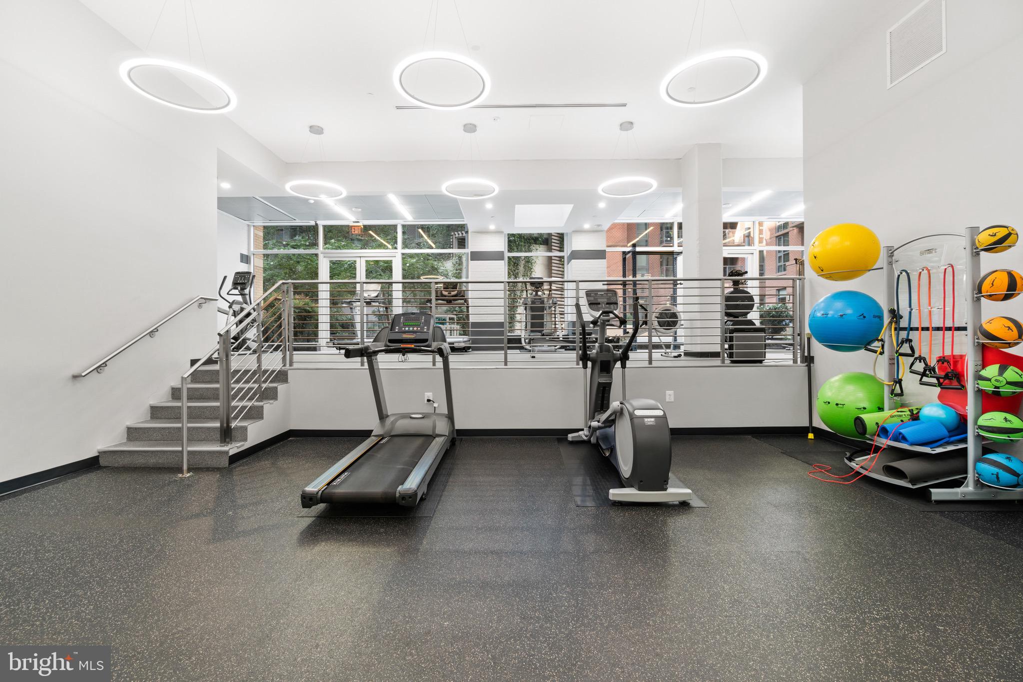 1025 First Street Southeast, Unit 1010 Washington, DC 20003 - Photo 32 of 36 a room with gym equipment and mirrors