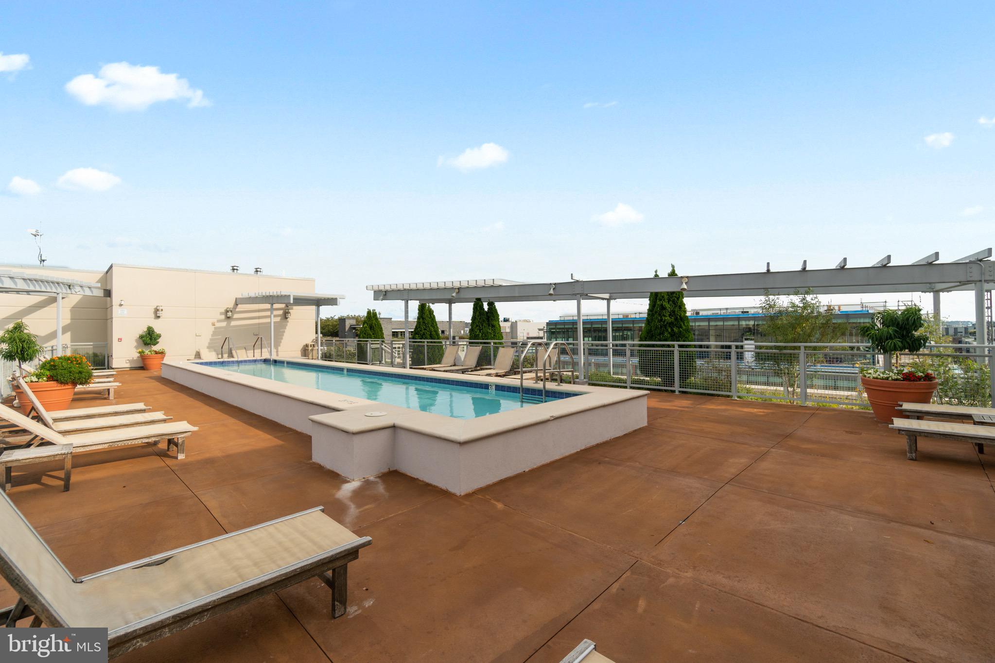 1025 First Street Southeast, Unit 1010 Washington, DC 20003 - Photo 34 of 36 a view of swimming pool with seating