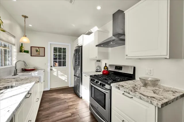 a bedroom with a bed and a tv