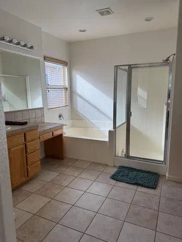 a kitchen with a sink a counter top space and cabinets